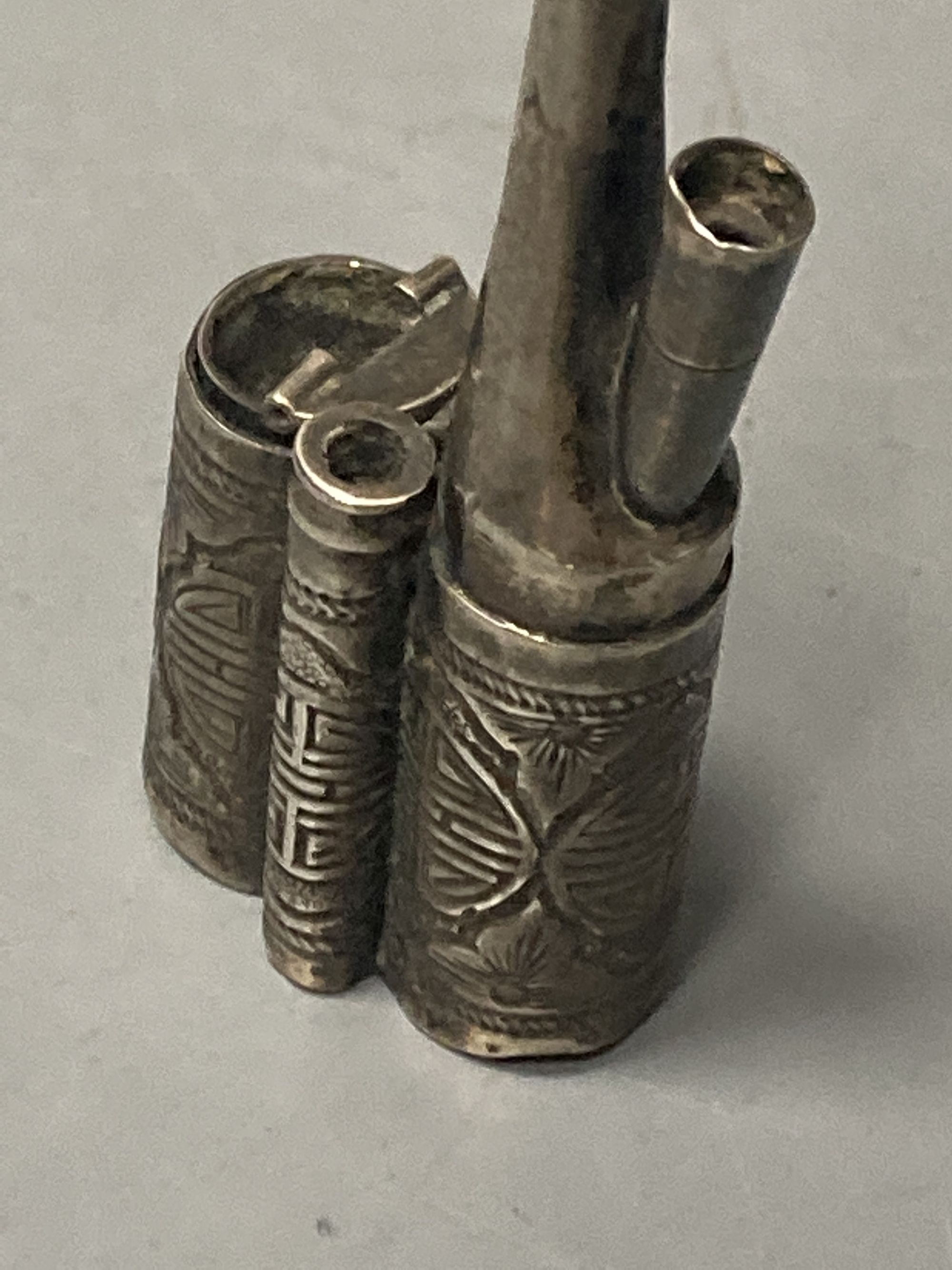 A Chinese white metal water pipe, by Wang Hing, 11.2cm, gross 27 grams.